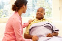 caregiver combing elderly